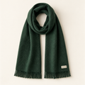 Houfycore Evergreen winter scarf in Forest Green, full view with fringed ends and cream brand label.